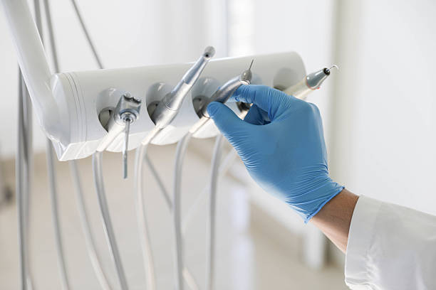 Professional Invisalign Clear Aligners technician working in West Orange, TX